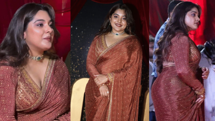 Nivetha thomas with red saree