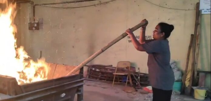 Woman cemetery caretaker in India :